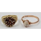 A 9ct rose gold moonstone single stone ring and a