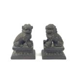 A pair of Chinese bronze models of Fo dogs, 10cm h