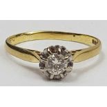 An 18ct gold single stone ring, the diamond in an