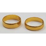 A 22ct gold wedding band, 5.7mm wide, finger size N 1/2 and another 2