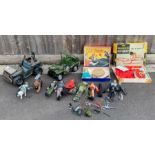 A collection of Action Man figures, cars and other