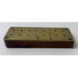 An early 20th century brass and oak cribbage board