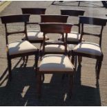 A set of six Victorian dining chairs with wide cur