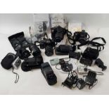 A collection of cameras and accessories including