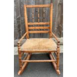 A 19th century oak and elm rocking chair, with rus