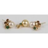 A pair of 9ct gold cultured pearl and emerald stud