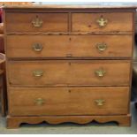 A 19th century pitch pine chest of drawers with br