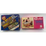 A Sindy boxed dining table and chairs, along with
