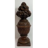 A 20th century oak carved finial, standing on a sq