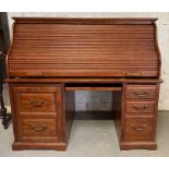 Large oak tambour front rolled top desk