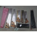 Collection of vintage handsaws including H Disston
