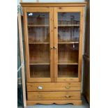 Modern glazed front pine bookcase