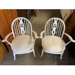 A pair of white painted Ercol chairs with open arm