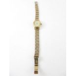 A ladies 9ct gold Rotary Elite wrist watch, the ov