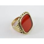 A carnelian set signet ring, the mount indistinctl