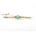 A turquoise and diamond bar brooch, unmarked, 6.3c