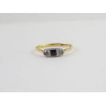 A three stone ring, stamped ‘18ct & Pt’, finger si
