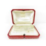 A vintage red leather Cartier watch box, 9.2cm x 6