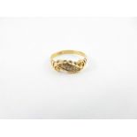 An Edwardian 18 carat gold diamond dress ring, fin