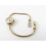 A ladies 9ct gold vintage Tudor wrist watch, the round cham