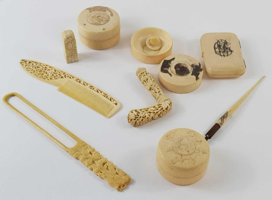 A collection of ivory items to include a comb with
