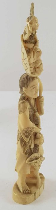 A Japanese ivory carved figure of a lady holding f - Image 15 of 20