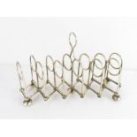 An unusual expanding silver plated toast rack