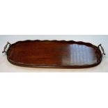 A mahogany serving tray, with brass carry handles,
