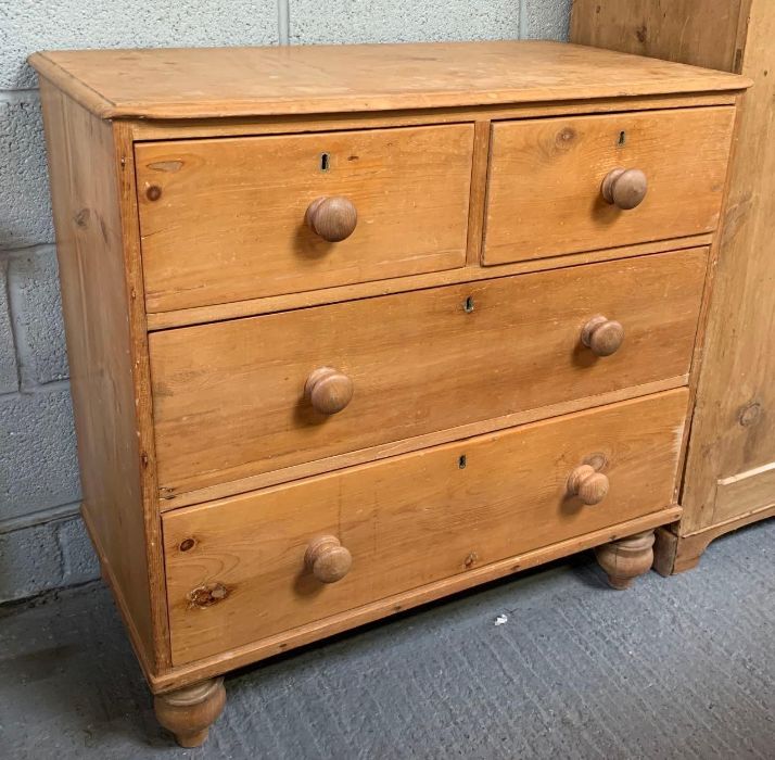 A Victorian pine chest of drawers with two long an