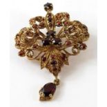 A 9ct gold garnet pendant/brooch, 5.5cm long inclu