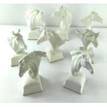 A group of eight Royal Worcester horses heads, all