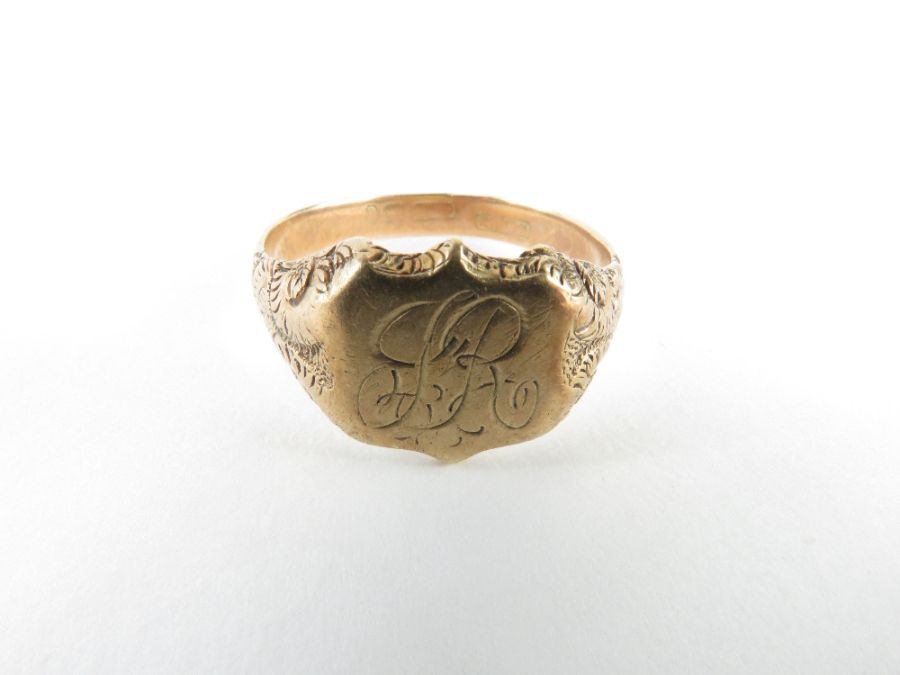 A signet ring with a shield shaped head, the head