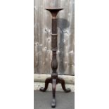 A Victorian mahogany torchere, reeded and carved d