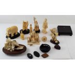 A collection of carved ivory items to include a bi
