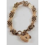 A gate bracelet with heart padlock and safety chai