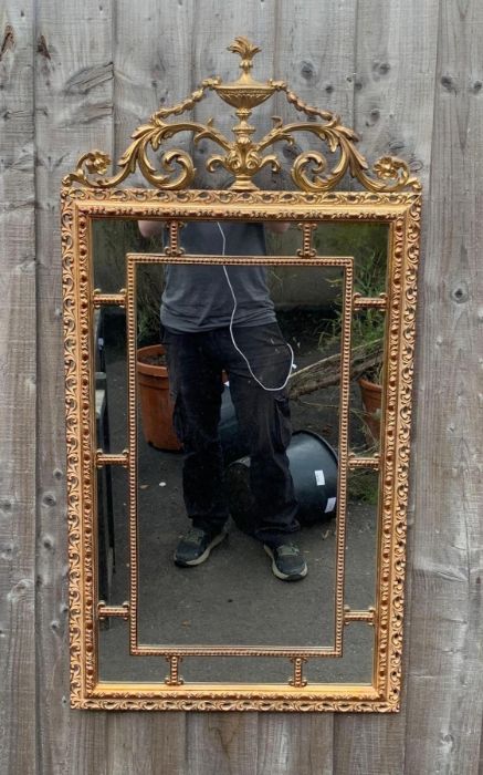 An Adams style mirror, in a gilt frame, 105cm x 52