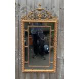 An Adams style mirror, in a gilt frame, 105cm x 52