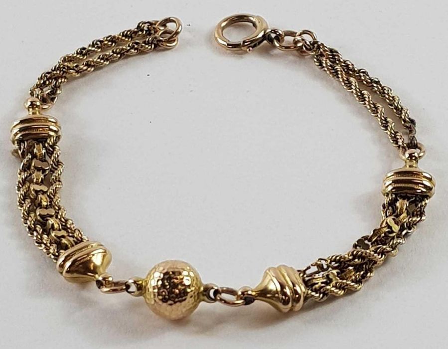 A fancy link bracelet with a central ball with ham