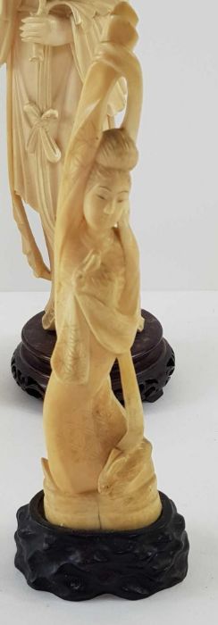 A Japanese ivory carved figure of a lady holding f - Image 8 of 20