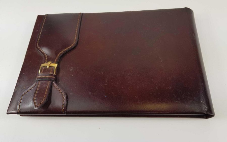 A Rolex leather covered note pad