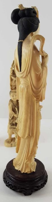 A Japanese ivory carved figure of a lady holding f - Image 13 of 20