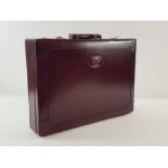 An unused brown leather briefcase