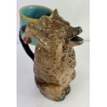 A Victorian majolica jug in the form of a bear hol