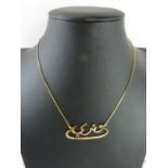 A necklet with central name section in Arabic, on