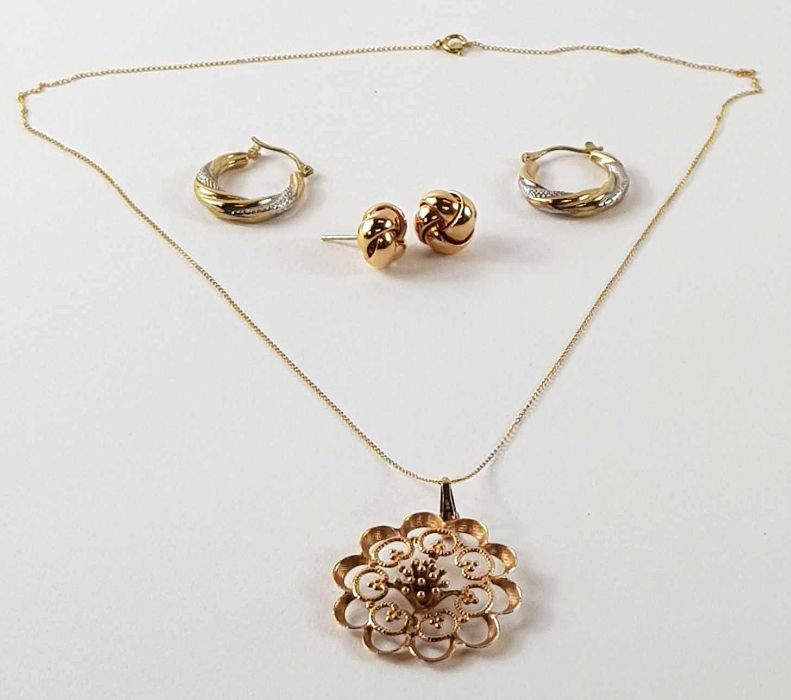 A 9ct gold open work flower pendant and a pair of