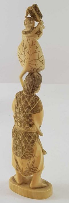 A Japanese ivory carved figure of a lady holding f - Image 17 of 20