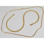 A flat snake chain, marked '14KT', and a slimmer f