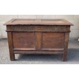 An 18th century oak coffer, with a hinged lid and