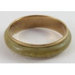 An unusual 9ct gold band ring with leather centre,