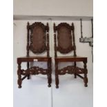 Pair of Victorian ornate dining chairs with rush b